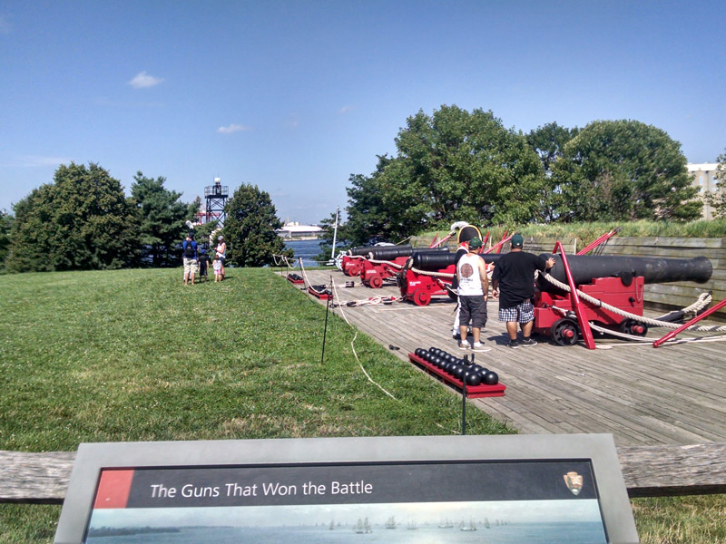 Ned, Louise, and Marie reviewing memorabilia